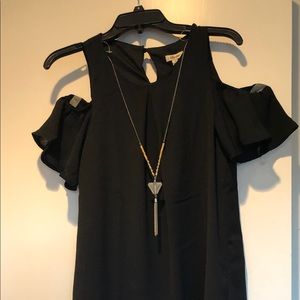 “Cold shoulder” dress in black